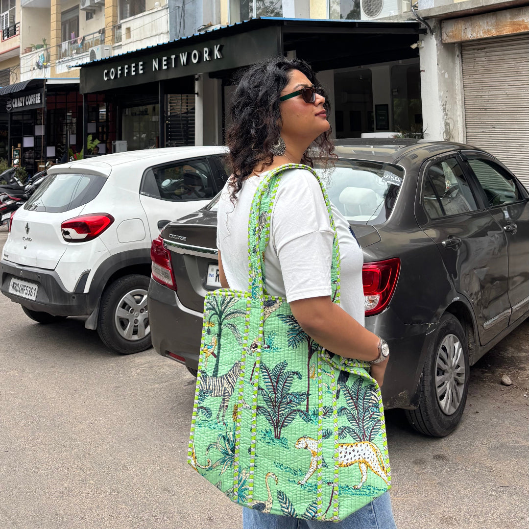 Woman walking on a street with a building and cars in the background